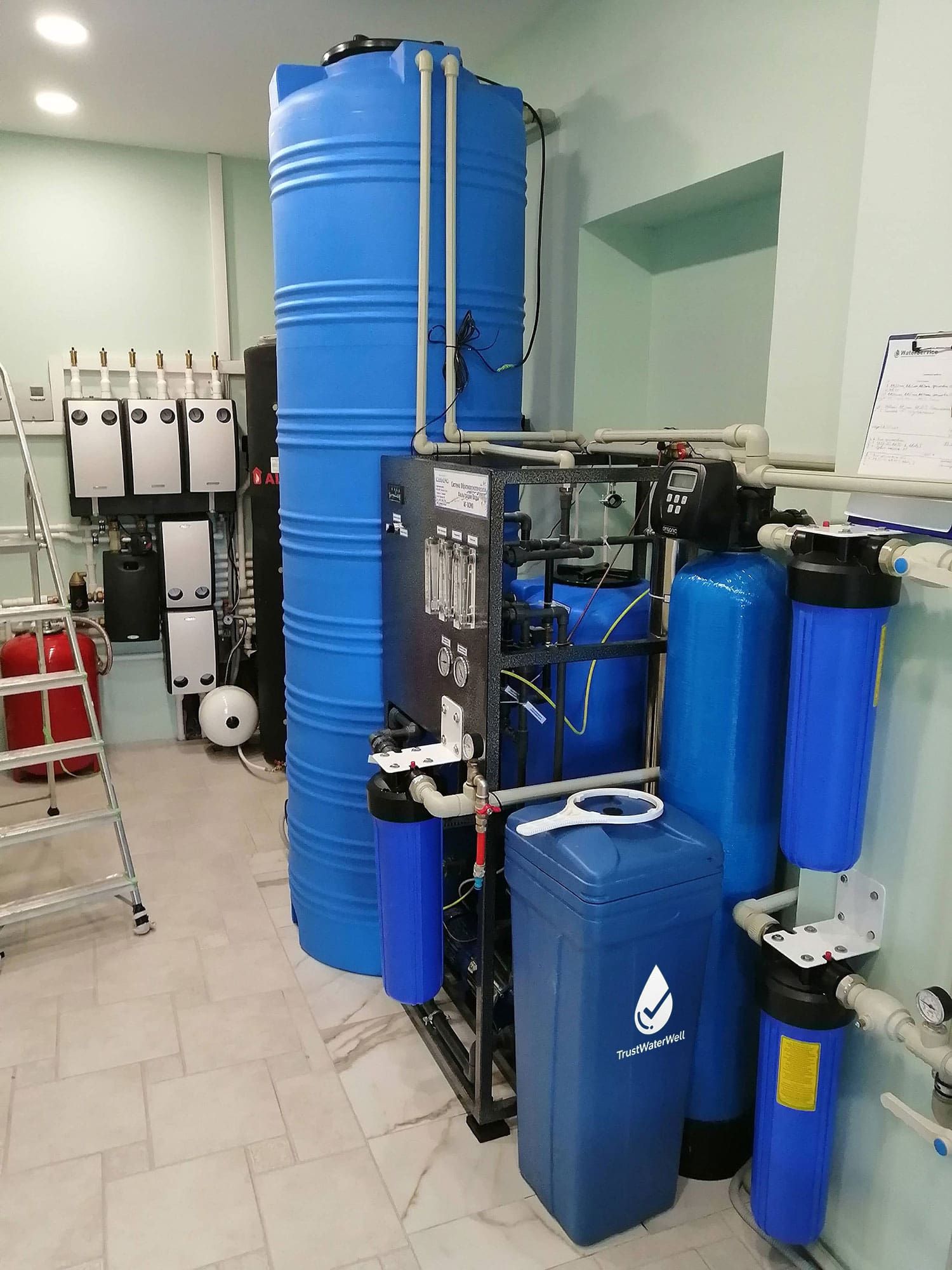 A neat and professional installation of a complete home water purification system, ensuring a reliable supply of safe, crystal-clear water.